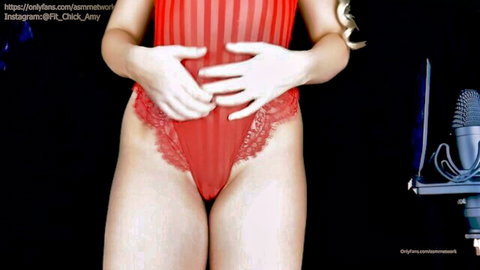 Blonde babe in sheer red lace lingerie pressing hands on her pussy with ASMR mic nearby