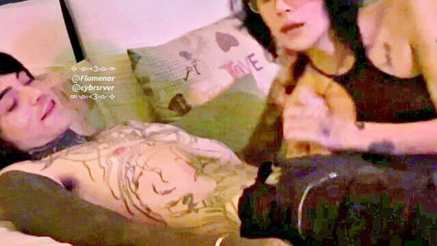 Two tattooed brunettes intimately groping tits and pussy on hotel bed