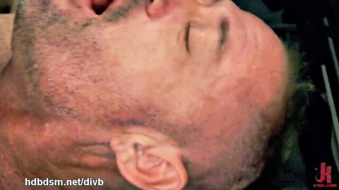 Bearded submissive man with open mouth gasping in ecstasy during femdom pegging