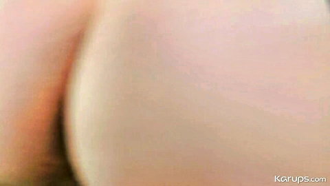 Closeup of pale ass cheeks spread wide exposing tight pink anus