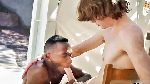Interracial gay twink boys in hot outdoor embrace with nipple lick and touch
