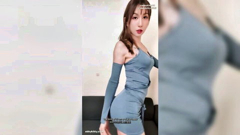 Skinny tanned Japanese brunette in tight blue dress teases her ass from behind