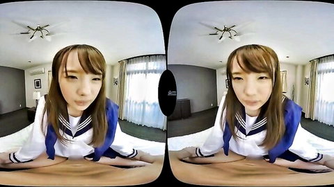 Japanese schoolgirl in sailor uniform spreads legs seductively on bed POV VR tease