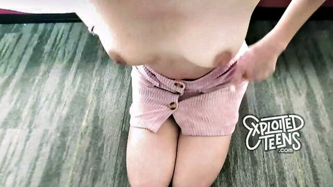 POV skinny tanned teen with small tits kneels spreading pink shorts exposing shaved pussy