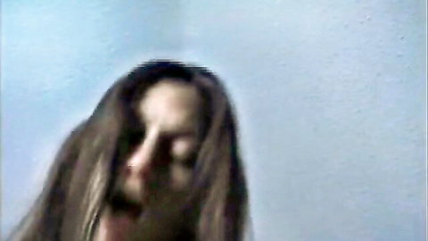 Brunette screaming with wide-open mouth in intense orgasm ecstasy closeup