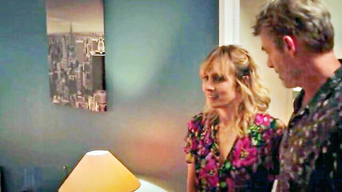 Julie De Bona in floral dress with co-star intimate scene
