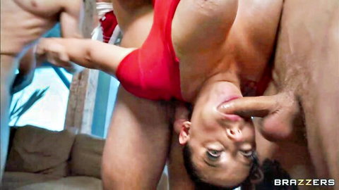 Curvy brunette deepthroats thick cock in upside-down blowjob surrounded by men