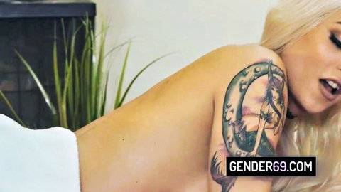 Domino Presley trans model topless in towel with mermaid tattoo