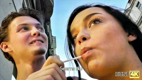 Young stud offers straw to brunette dame in teasing outdoor pickup moment