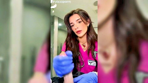 POV of sexy brunette nurse in pink scrubs teasing medium tits cleavage with blue latex gloves