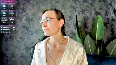 Lillian White mature British MILF in open silver blouse with glasses