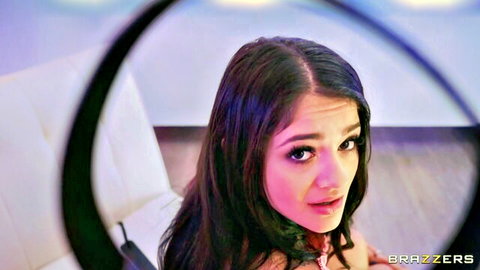 Seductive brunette with intense gaze in Brazzers HotAndMean scene