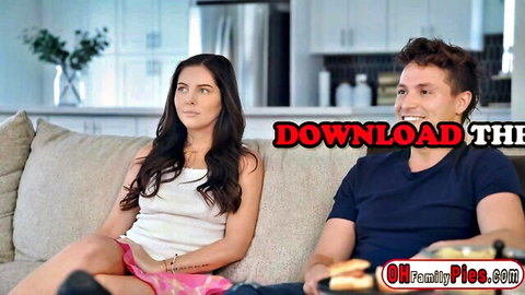 Brunette stepsister in white top and pink skirt sits teasingly with stepbrother on couch
