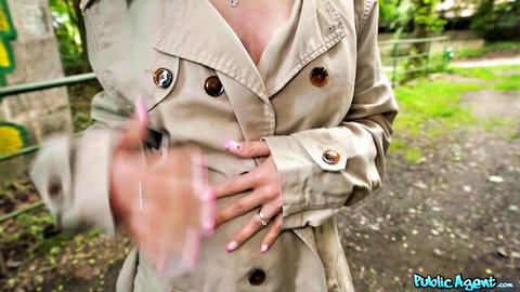 Busty babe in open trench coat flashes pussy outdoors fingering herself for public agent