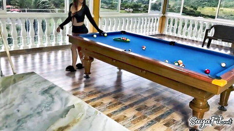 Anissa Miller in lingerie bending over, teasing with pool cue and balls