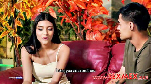 Brunette Latina teen in tight camisole sits close to guy on red couch saying I see you as a brother