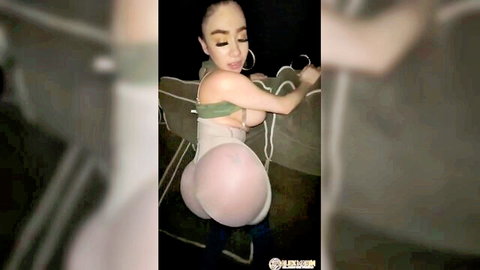 Curvy Latina babe with massive pink ass and big tits in tight thong posing on couch
