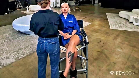 Elana Bunnz blonde in sexy blue robe, legs spread showing thigh tattoo
