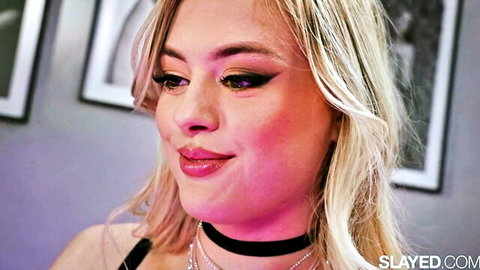 Blonde Peaches in seductive close-up with choker necklace