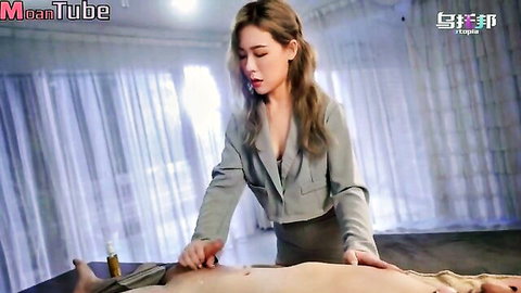 Sexy Asian office lady in suit massages shirtless man's abs teasingly