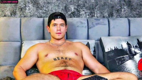 Chiseled muscular live-streamer Arilass posing in red underwear