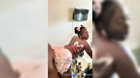 Jenise in pink tutu teasing with big ebony ass
