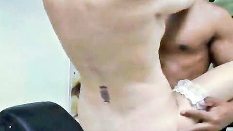 Muscular shirtless stud grabs hot babe's hips in lacy panties from behind revealing lower back tattoo