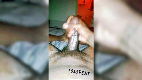 Ebony hand stroking massive shiny black cock in closeup amateur handjob