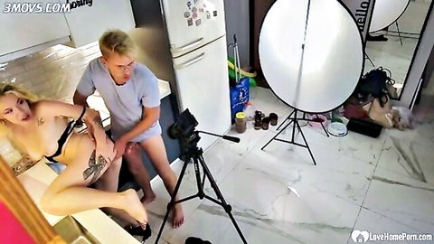 Tattooed blonde babe's big tits exposed as guy fingers her pussy in kitchen lingerie tease