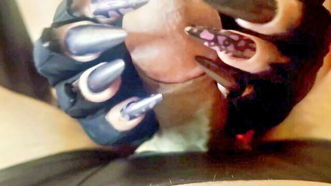 Mistress in leather gloves with purple leopard nails stroking hard cock closeup