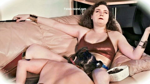 Curly-haired brunette dominates naked man with facesitting oral on couch