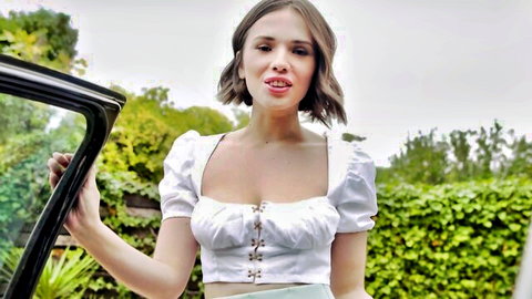 Brunette Eve teasing in white corset top by luxury car outdoors