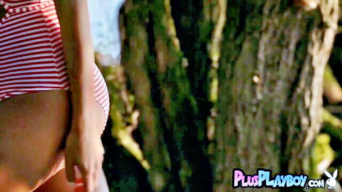 European MILF with small tits posing in striped bikini outdoors