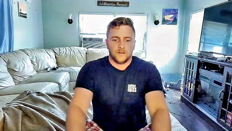 Muscular white gay wrestler in black t-shirt and red shorts, mature solo preview
