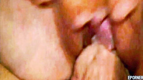 Man's tongue licking blonde's wet pussy lips and swollen clit in extreme closeup cunnilingus