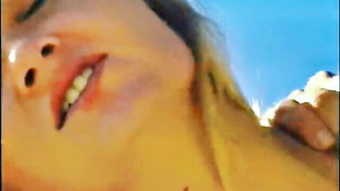 Blonde babe smiling with open mouth and teeth during outdoor blowjob closeup