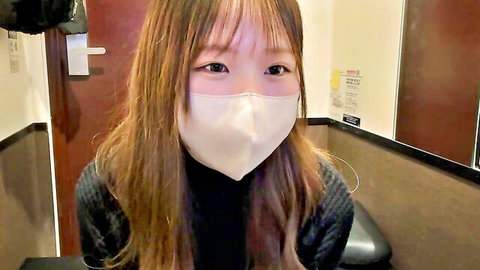 Cute Asian girl with bangs smiling under white mask in bathroom webcam tease