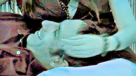 Mahalat Sánchez in intimate close-up with smiling man, hand on head (2007)
