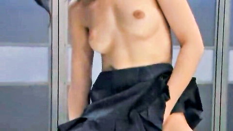 Skinny topless brunette with small perky tits posing in short black pleated skirt