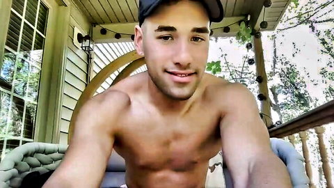 Muscular shirtless gay teen smiling seductively on outdoor porch swing amateur webcam