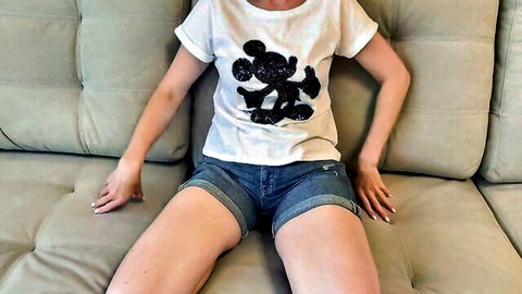 Russian amateur stepdaughter in cute Mickey Mouse t-shirt and denim shorts sitting spread-legged