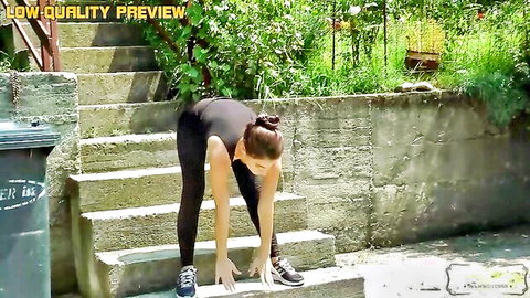 Ellie bending over in tight black leggings for sexy fitness stretch
