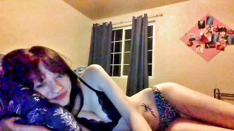Laneystone redhead teen in black lingerie showing cleavage