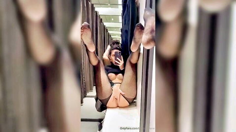 MILF spreads legs wide in store fitting room exposing bare pussy and ass in black lingerie selfie