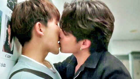 Two slim Asian men passionately kissing in boys love scene