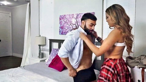 Teen coquette in plaid skirt seducing fit bearded guy during foreplay