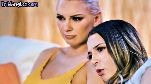 Busty blonde and brunette lesbian babes in tight tops staring intensely with open mouth tease