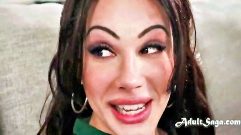Ariel Demure smiling seductively in green top from TS threesome