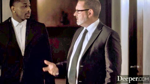 Jill Kassidy in Deeper scene with suited men in intense business talk