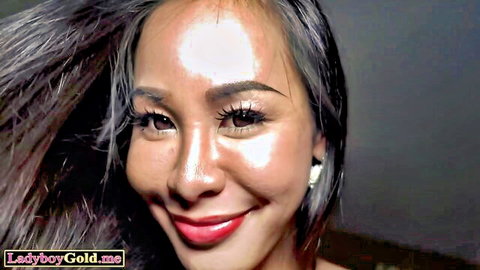 Beautiful Southeast Asian woman with glossy red lips smiling seductively close-up